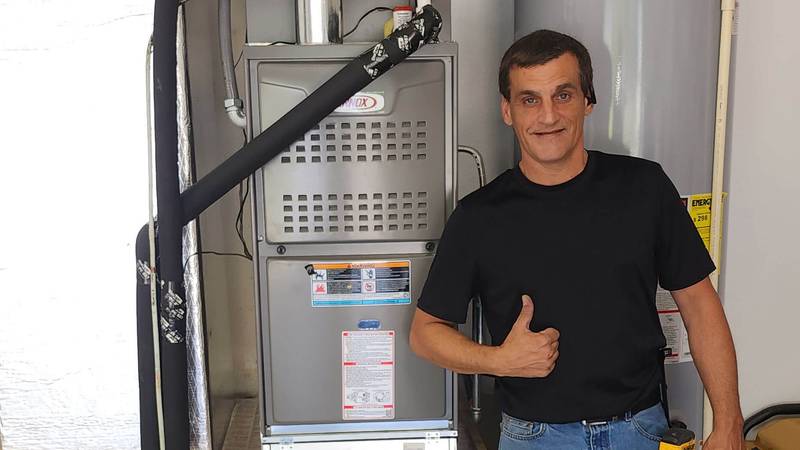 Picture of Owner next to Lennox Furnace