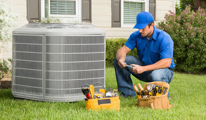 Technician performing HVAC maintenance in Ocala FL